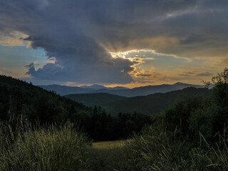 Sunset with a dramatic sky over the hills in Central Slovakia