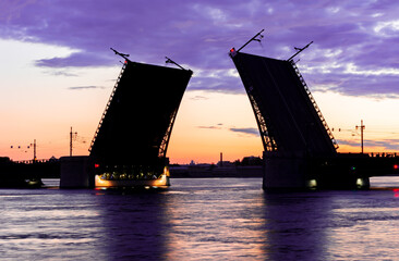 Fototapeta na wymiar Silhouette of raised Palace bridge at white night, Saint Petersburg, Russia