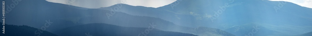 Wall mural sun rays and rain in the carpathian mountains in summer