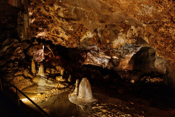 Koneprusy, Czech Republic, 24 July 2021: Natural dripstone rock formations with stone decoration in Koneprusy limestone caves in Bohemian Karst, underground world with stalagmite and stalactite halls