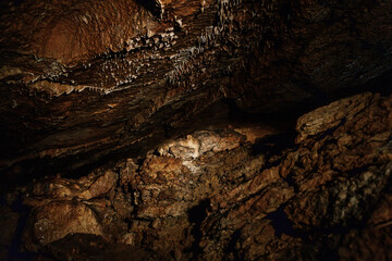 Koneprusy, Czech Republic, 24 July 2021: Natural dripstone rock formations with stone decoration in Koneprusy limestone caves in Bohemian Karst, underground world with stalagmite and stalactite halls