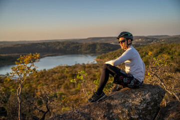 man sitting on a rock bike