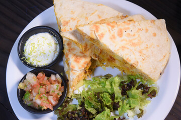 Burritos wraps with beef and vegetables on black background. Beef burrito, mexican food. Banner