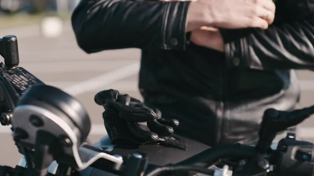 close up of biker gloves on a motorcycle
