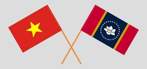 Crossed flags of Vietnam and the State of Mississippi. Official colors. Correct proportion