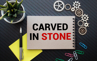A smooth river stone is etched with the word faith for spiritual affirmation purposes.