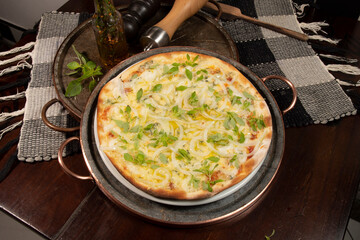 Brazilian style pizza with mozzarella, cheese, onion
