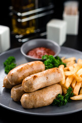 austrian grilled sausages with french fries are a traditional snack