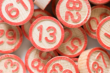 retro bingo game pieces or solid wood discs with numbers up close