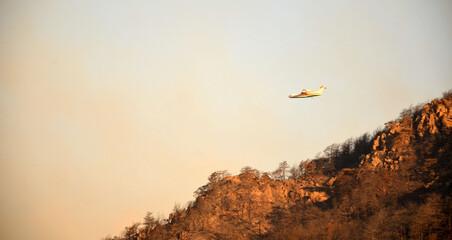 Russian plane draws water from the sea to extinguish a forest fire.  Marmaris,Turkey