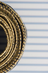 intricate but visually attractive navy blue and gold ribbon close up