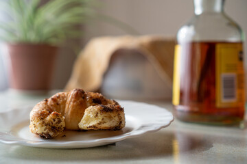 delicious Croissant and a coffee on a light table and some background elements