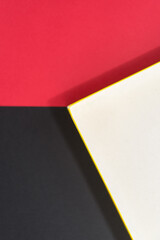 old cardboard box lid on red and black paper, or abstract composition in off white, red, and black