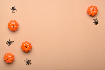 Background for the Halloween holiday with pumpkins and spiders there is a place for text. Minimalism.