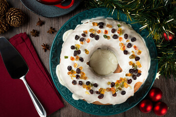 Christmas cake with fondant and candied fruit.