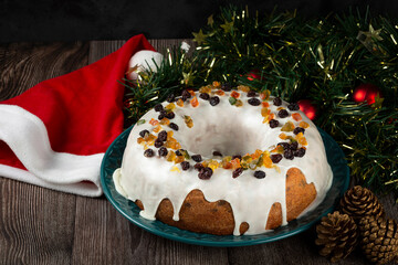 Christmas cake with fondant and candied fruit.