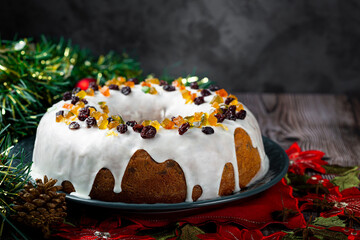 Christmas cake with fondant and candied fruit.
