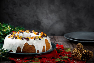 Christmas cake with fondant and candied fruit.