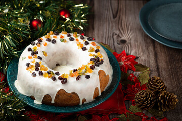 Christmas cake with fondant and candied fruit.