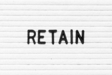 Black color letter in word retain on white felt board background