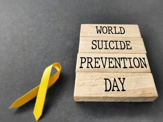 Celebration Day Concept - World suicide prevention day words on wooden blocks background. Stock...