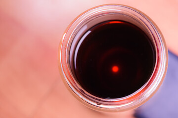 Take a close-up shot of a glass of tea from above