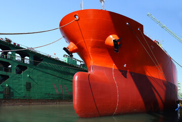 a large ship under construction at a shipyard