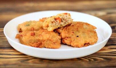 Crispy fried misua cake on white plate. Misua or misoa is thin and soft wheat noodles.