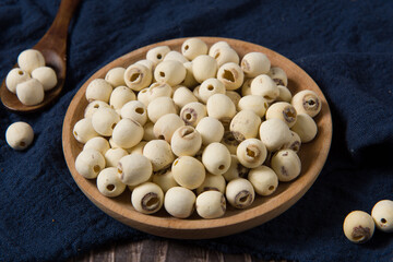 dry Lotus seed or lotus nut on wooden background