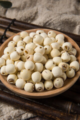dry Lotus seed or lotus nut on wooden background