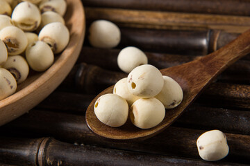 dry Lotus seed or lotus nut on wooden background