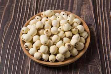 dry Lotus seed or lotus nut on wooden background
