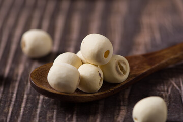 dry Lotus seed or lotus nut on wooden background
