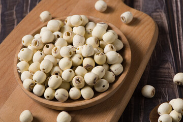 dry Lotus seed or lotus nut on wooden background