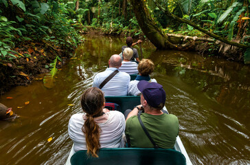 Canoe transport tourist excursion along the rivers of the Amazon rainforest river basin, Yasuni...