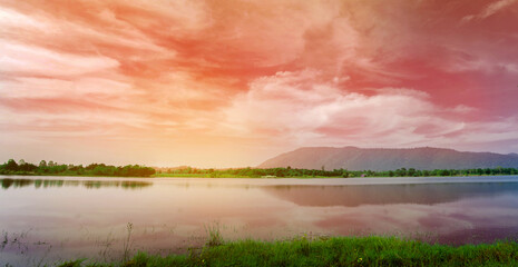 Mountain landscape behind lake and dramatic beautiful sky