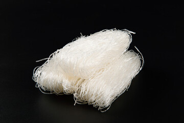 Raw bean vermicelli or dry glass noodles on black background
