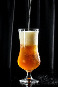 Frosty glass of light beer, craft beer with thick foam, vertical image. place for text