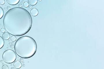 serum or cosmetic liquid water bubbles floats drops surface background