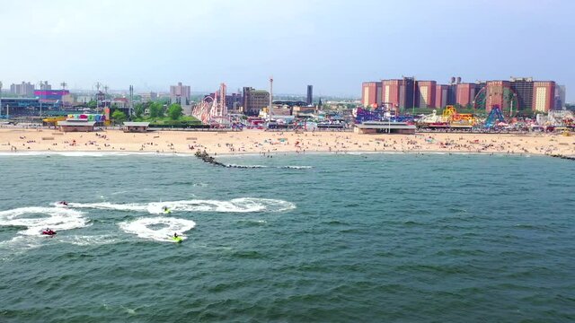 Aerial Shot of an African American Teenagers Driving Jet Skies in Coney Island