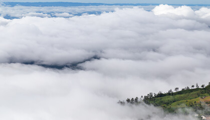 Sea of fog cover on the mountain flowing and the small village. 