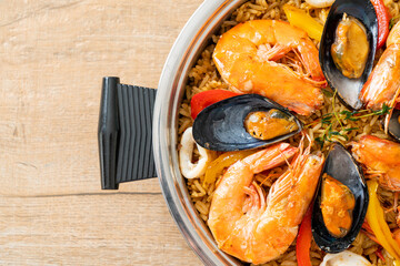 Seafood Paella with prawns, clams, mussels on saffron rice