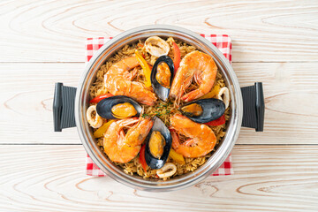 Seafood Paella with prawns, clams, mussels on saffron rice