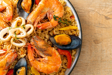 Seafood Paella with prawns, clams, mussels on saffron rice