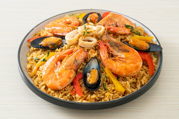Seafood Paella with prawns, clams, mussels on saffron rice