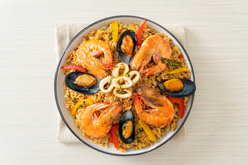 Seafood Paella with prawns, clams, mussels on saffron rice