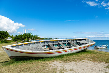 Naklejka na ściany i meble Fishing boat at Bain des Dames, fishing spot found near Cassis in Port Louis, Mauritius.