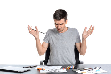 Upset male calligrapher on white background