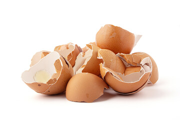 Group of broken eggshells stacked isolated on a white background. Eggshells are oval, brown, brittle and thin, easily broken.
