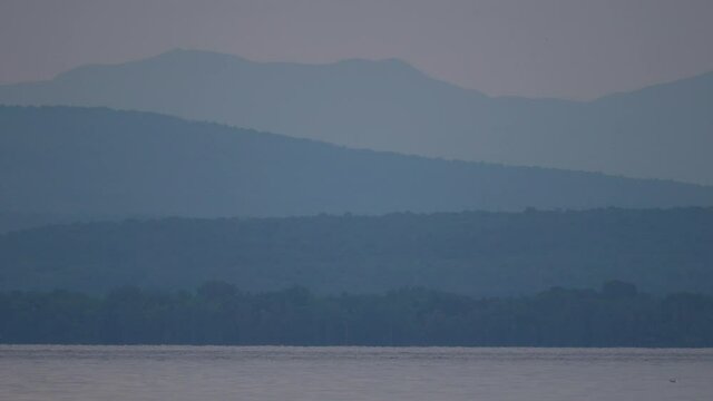 A calm landscape shot of Lake Champlain.  This is one of the many breathtaking views seen from the shores of Grand Isle, Vermont.